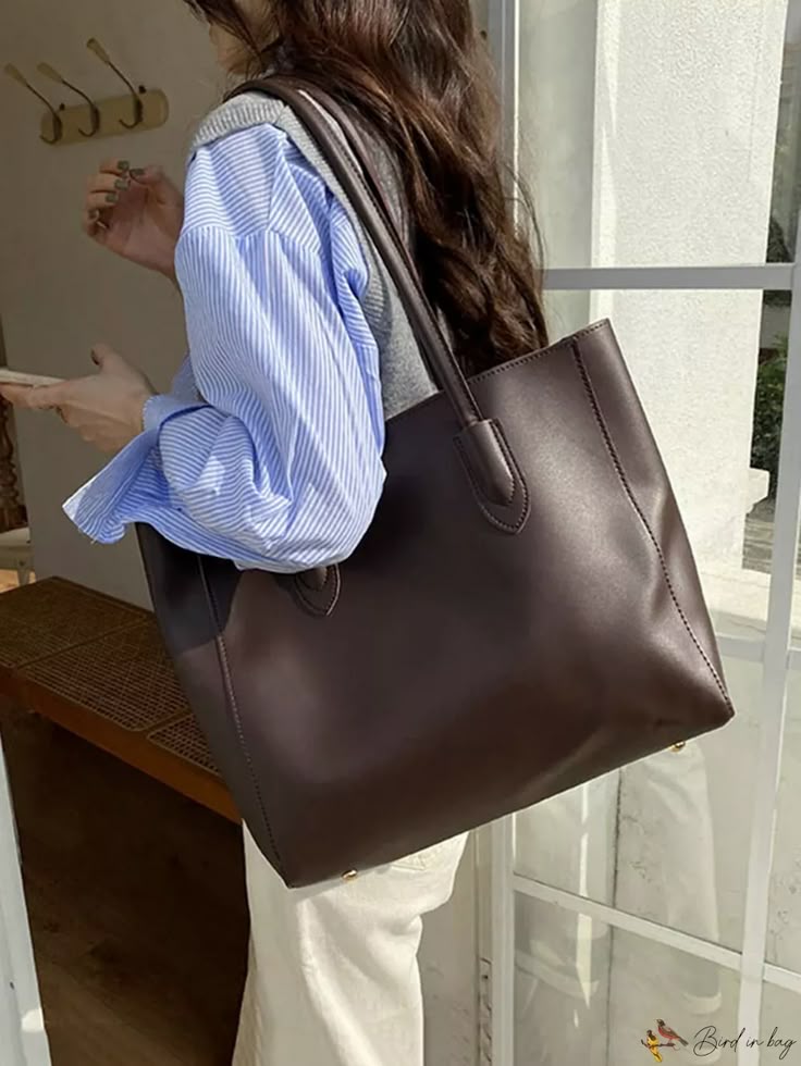 A collection of elegant and spacious work bags perfect for office and business use.
